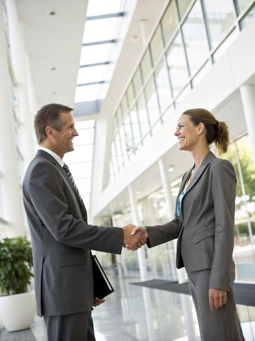 Two business professionals shaking hands